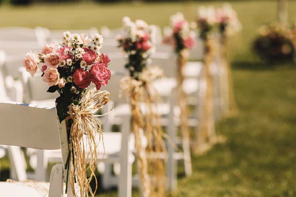bows-rope-twine-pink-bouquets-white-chairs-600x400